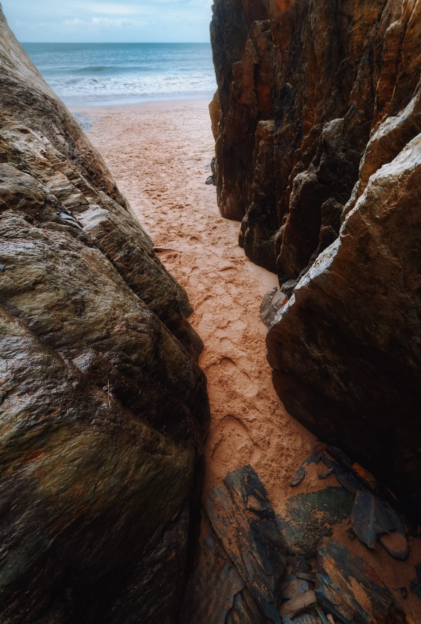 Further down the beach I found this rather deep sea cave that had been carved out by the Irish Sea. I tucked myself deep into the cave as far as I could, then turned back towards the sea and shot multiple exposures for this composition.