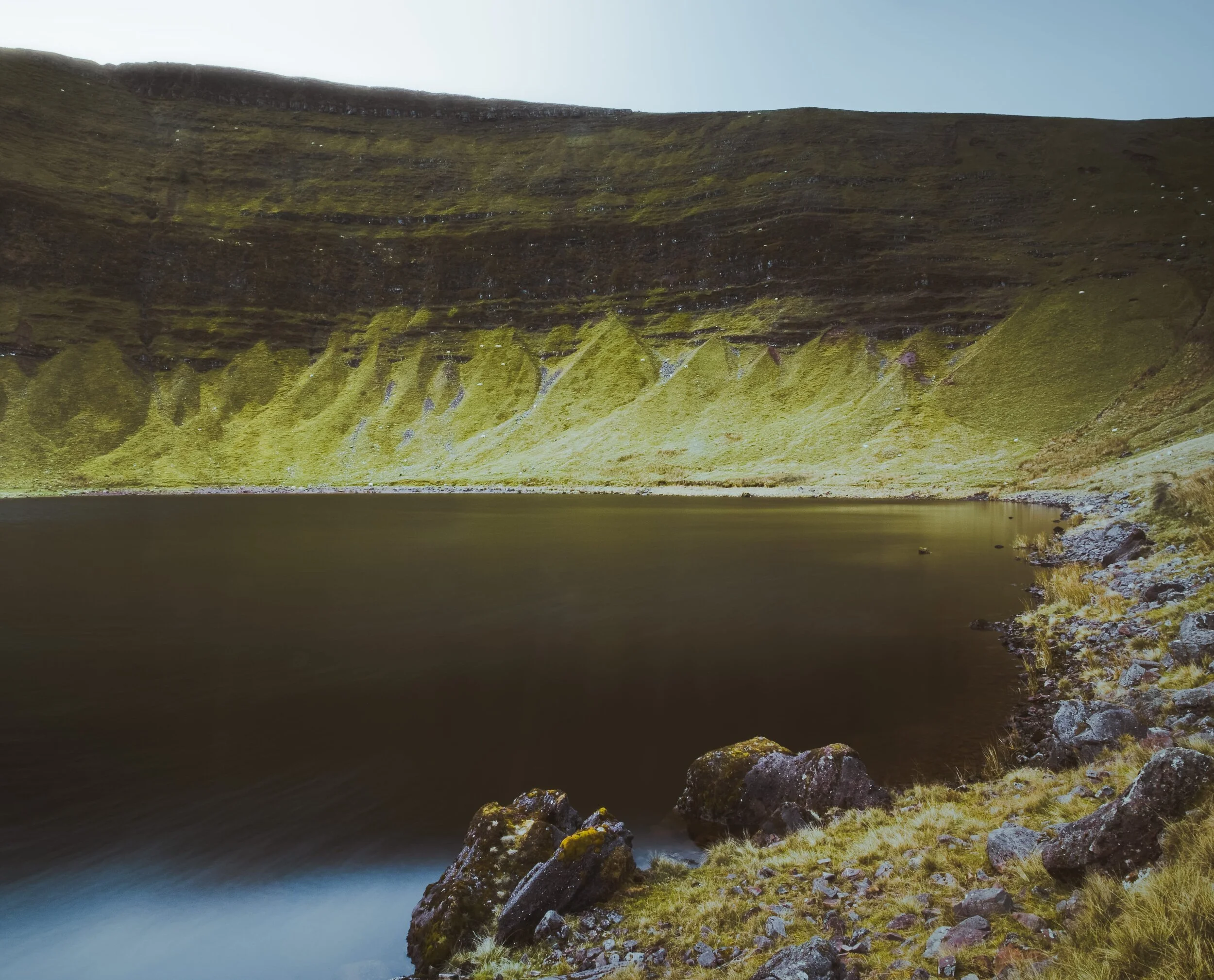 A composition towards Llyn y Fan Fach’s west end, showing the sheer wall of the Carmarthen Fans.