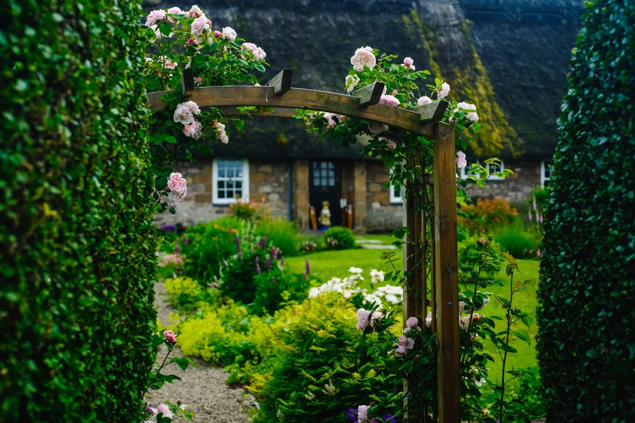 Just a few doors down the street from The Black Bull is another cottage with a thatched roof. And a ridiculously pretty front garden.