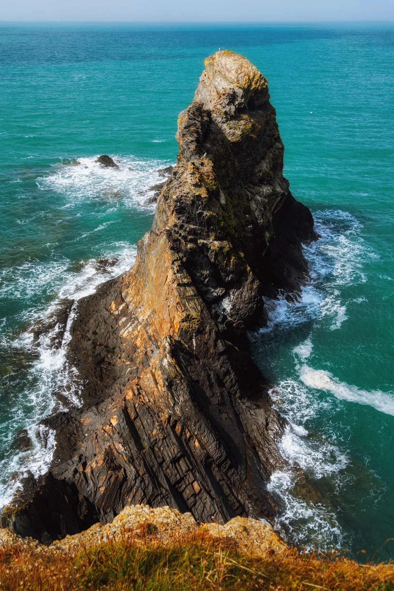 Looking down on the seemingly impossible-looking sea stack of Careg Wylan , twisting and rising like a corkscrew above the sea. Just ridiculous.