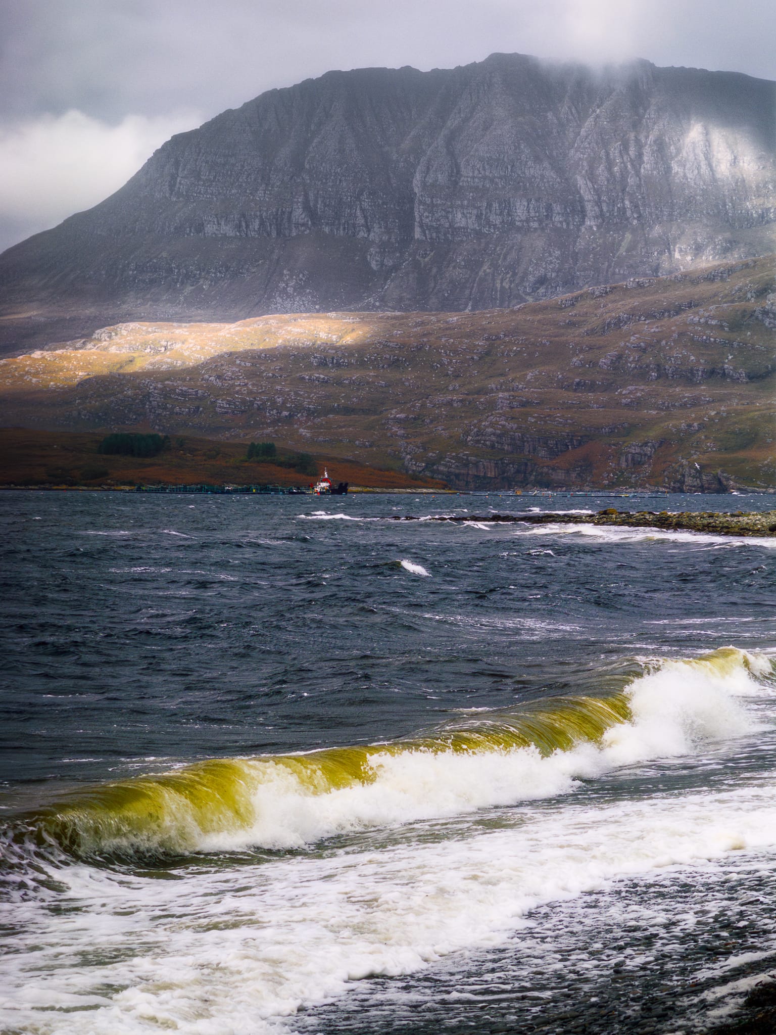 On the way to the Inverpolly area, north of Ullapool, there&rsquo;s a small bit of coastline called Ardmair and it offers a stonking taster of what&rsquo;s to come. Across Loch Canaird, Ben Mor Coigach (743 m/2,438 ft) presents as a sheer wall rising straight out of the sea. We stopped for photos as we battled the powerful gusts in the storm.
