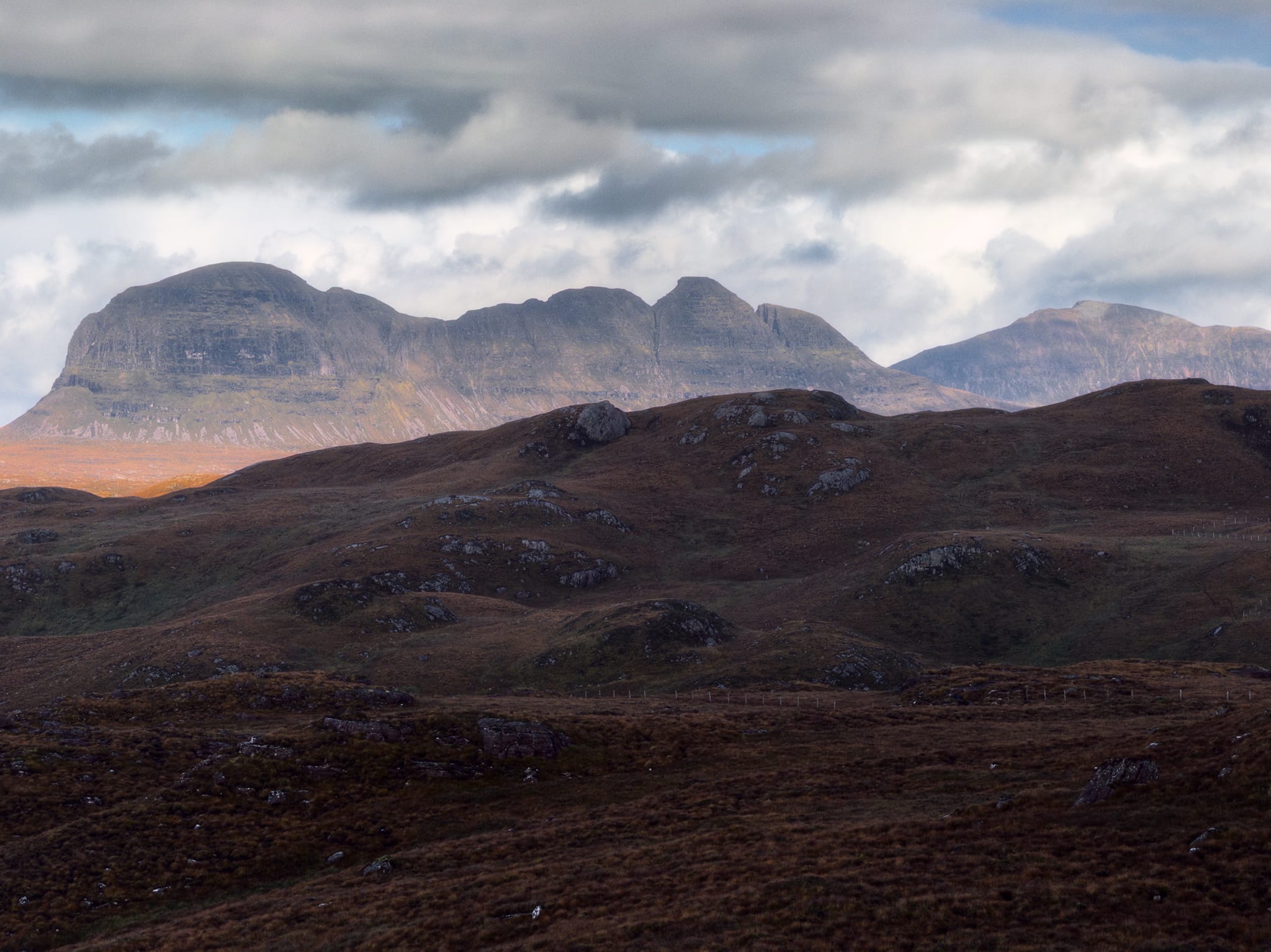 It was also at this location that I got my first view of the incredible Suilven, an isolated fin of a mountain. Again I zoomed in and waited for the light to move on from the nearby moorland to highlight just the mountain.