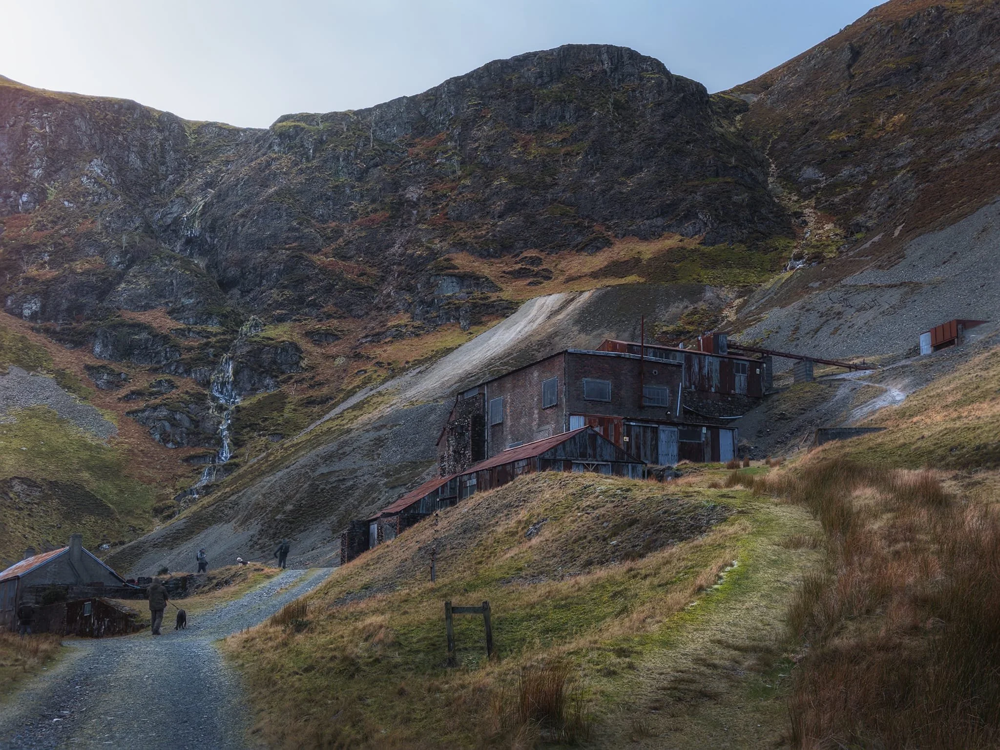 The head of Coledale, featuring the processing mill that still stands, with the dark face of Force Crag high above. Cutting Force Crag in two is Low Force to the left, barely more than a trickle as most of it was frozen.
