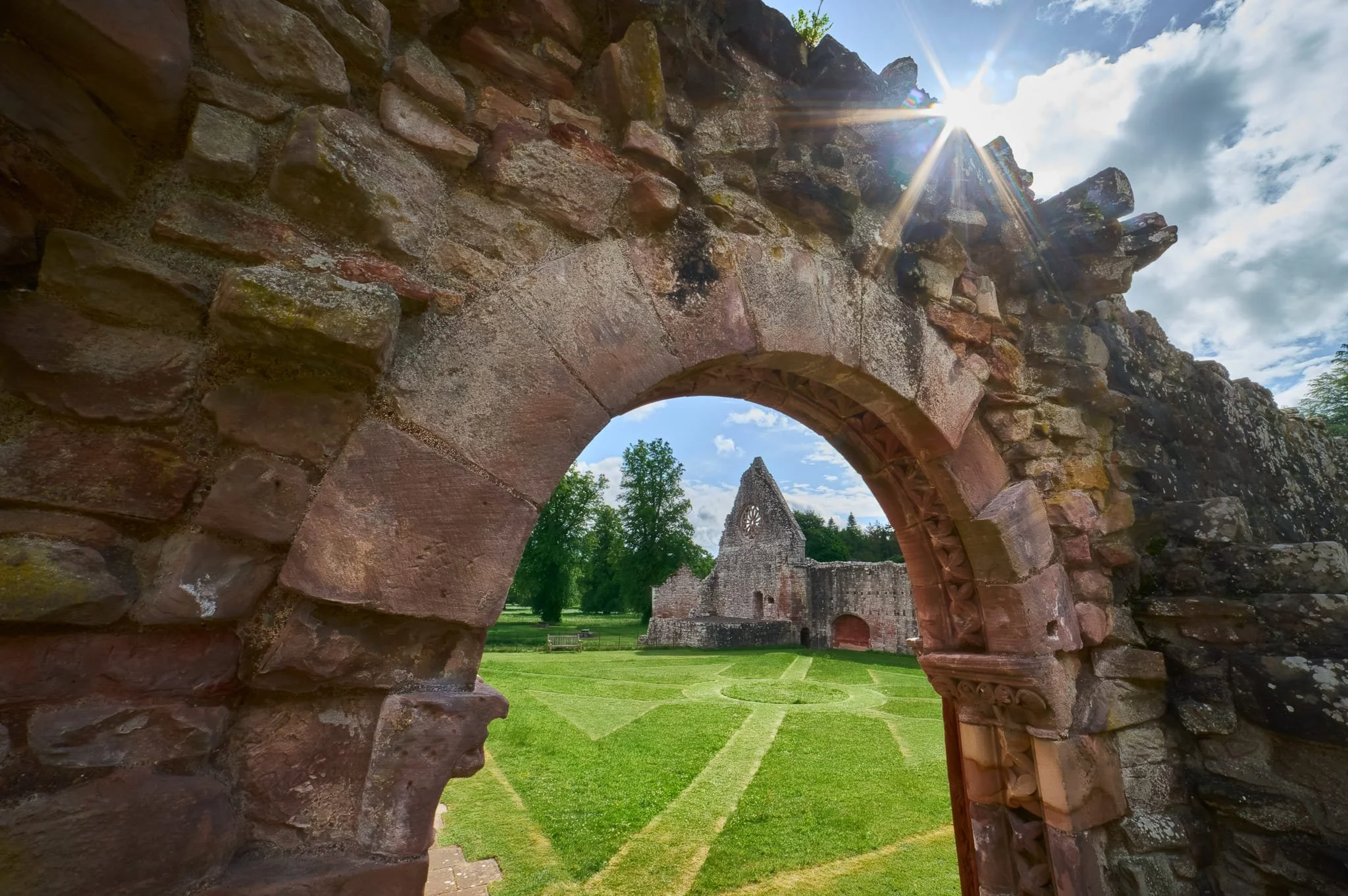 The same entrance, now looking towards the refectory with the beautifully detailing of St Catherine’s wheel window. I enjoyed the beautiful maintained courtyard, and used its lines as a compositional aid.