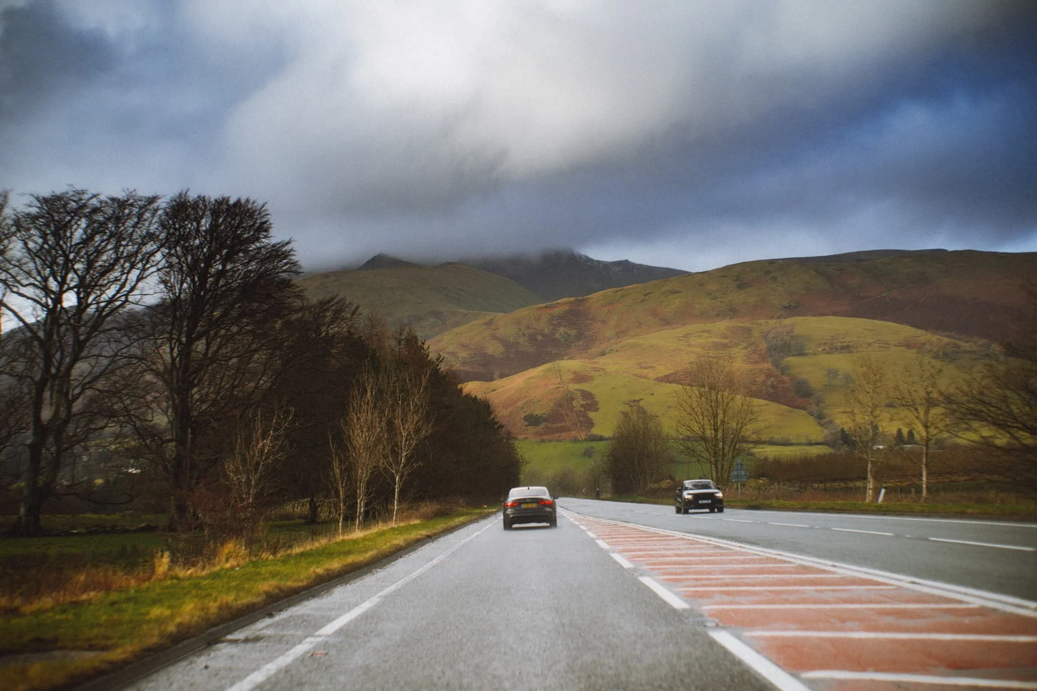 We elected for the scenic route back to Kendal, heading north out of Patterdale, through Matterdale, and onto the A65. That way we could turn off to head down St. John’s in the Vale and join the A591 back to Kendal. I kept my camera out, with the 55m attached to it, and grabbed this epic scene of Blencathra from the passenger’s side.
