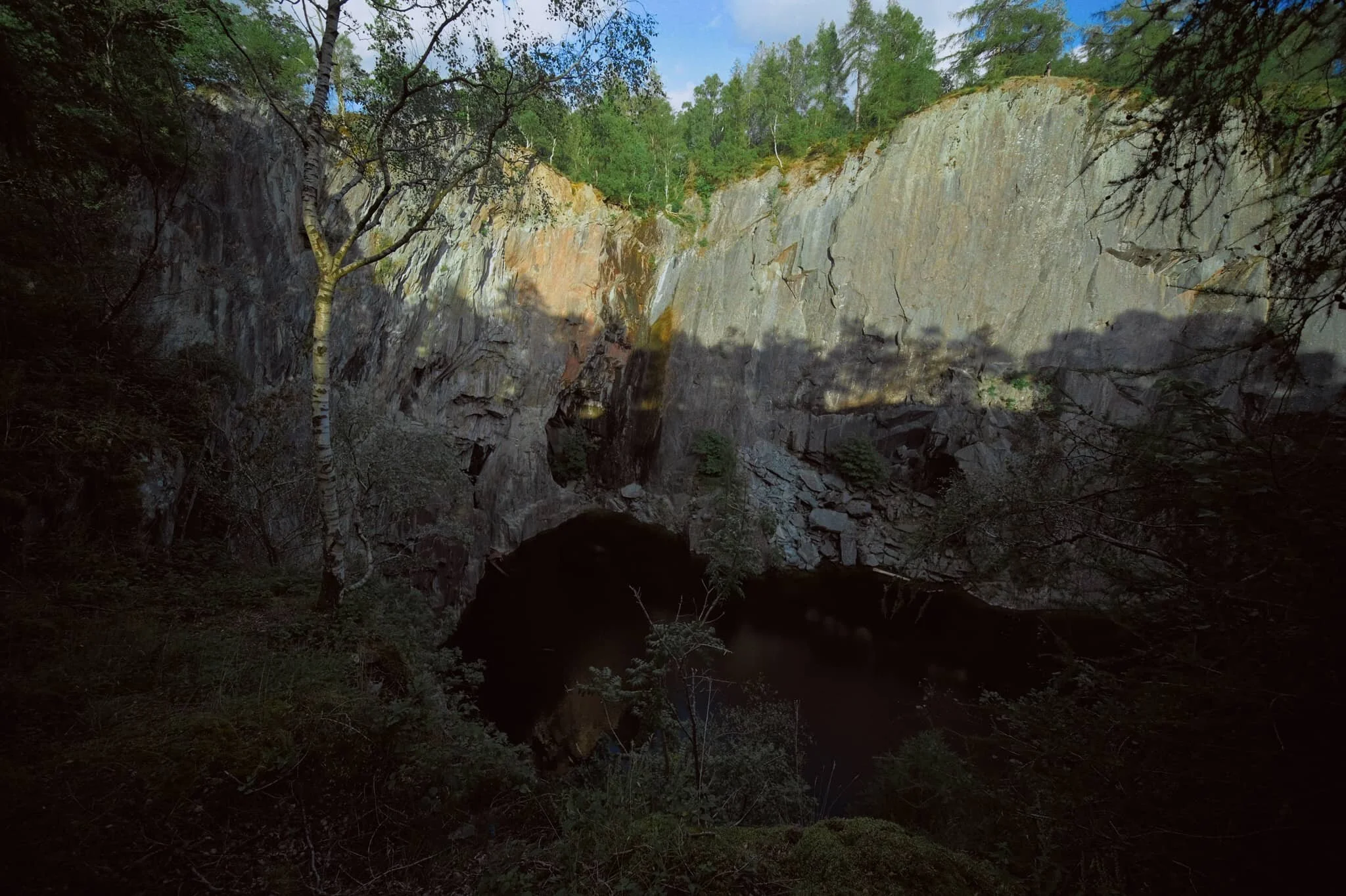 Thankfully, with my 9mm ultra-wide lens at hand, I was able to capture immense compositions that could feature both the dark pool and the sheer walls of the quarry, all at once.