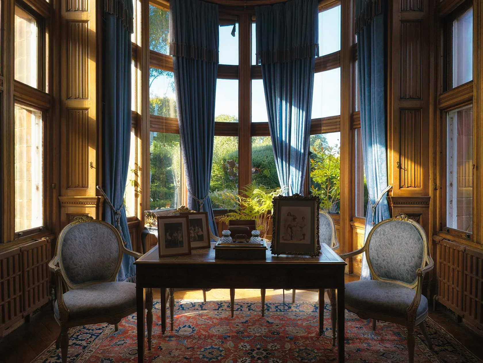 A beautiful view to the gardens with gorgeous light filtering through in the Drawing Room.