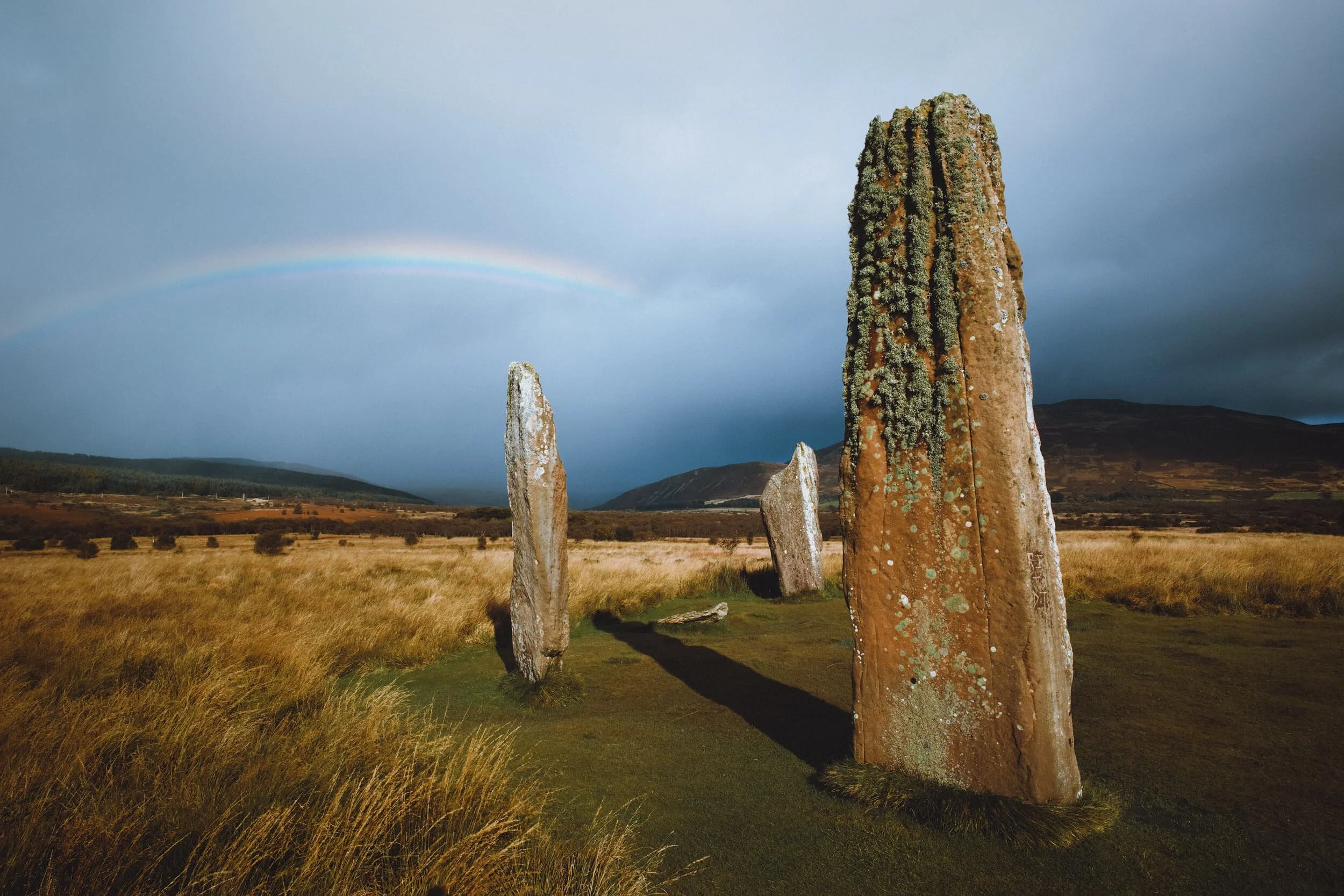 When we arrived some stormy clouds moved over the moorland in front us. This unfortunately blocked our view of the mountains, but more than made up for it with some incredibly vivid rainbows! I reached an emotional state of 50% panic and 50% ecstasy, running around the stone circles trying to shoot as many meaningful compositions as possible whilst the rainbow was still visible.