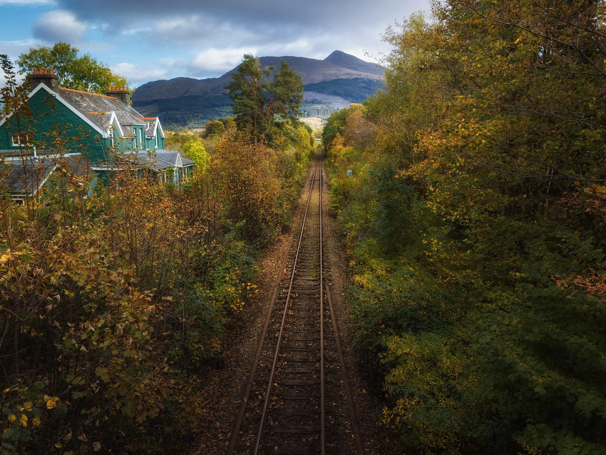 Heading back into the village a bridge crosses over the West Highland Railway line, offering a perfect leading line all the way towards the unmistakable shape of Ben Cruachan .