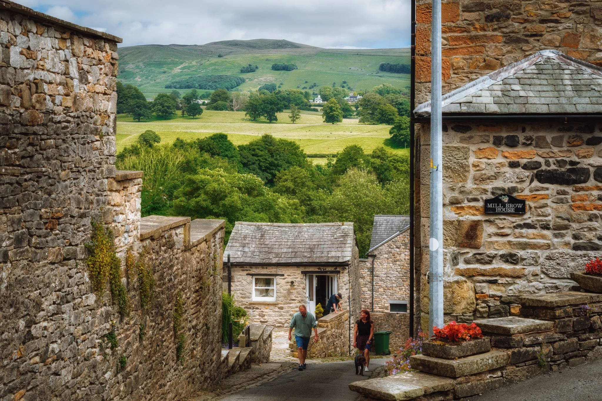 Looking down Mill Brow as it steepens, another wonderful view opens up towards Gragareth (627 m / 2,057 ft). Historically this fell formed the boundary between the West Riding of Yorkshire and Westmorland; there’s still a drystone wall up there that follows the old county boundary.