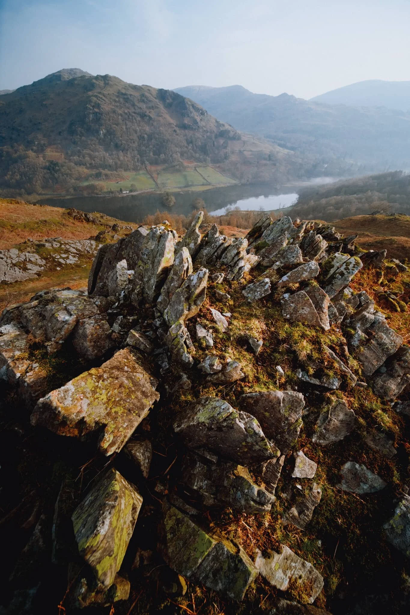We carefully picked our way back down the wet northern slopes of Loughrigg, stopping for the occasional photo along the way. This area of the fell was extensively mined for slate in the Victorian era, now long abandoned. Its remnants make for interesting compositions towards Nab Scar and Rydal Water.