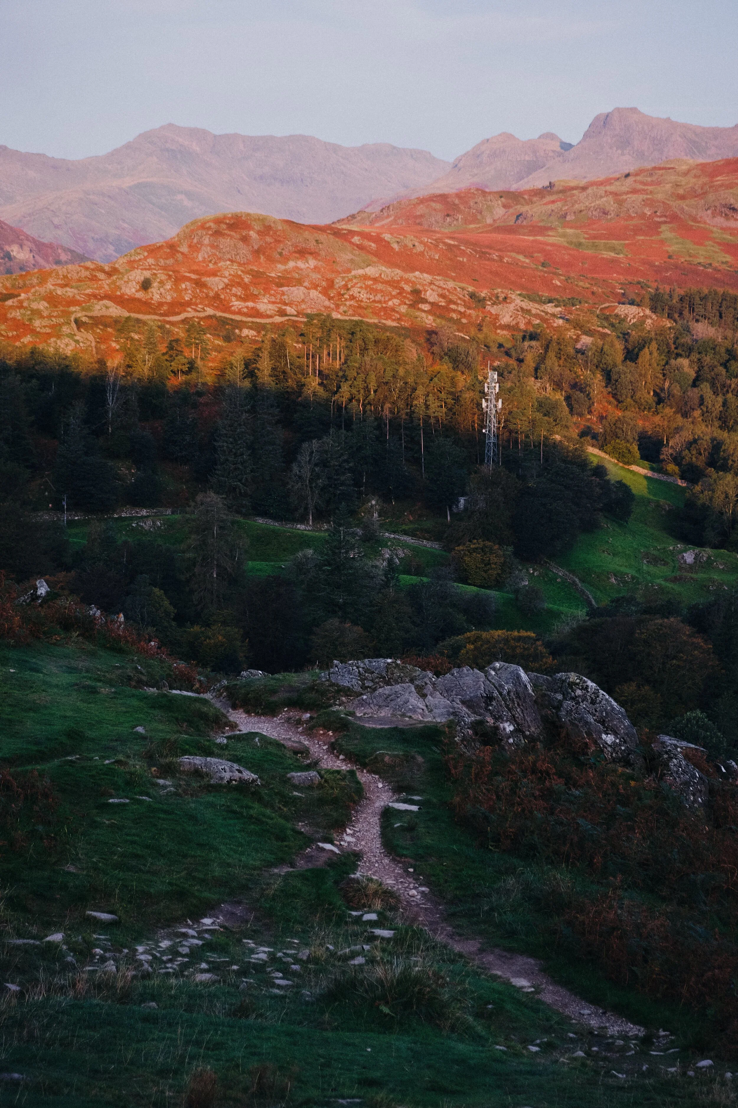 Higher up we can better make out the Langdale Pikes and Crinkle Crags (859 m/2,818 ft) as more of the land is bathed in warm sunrise light.