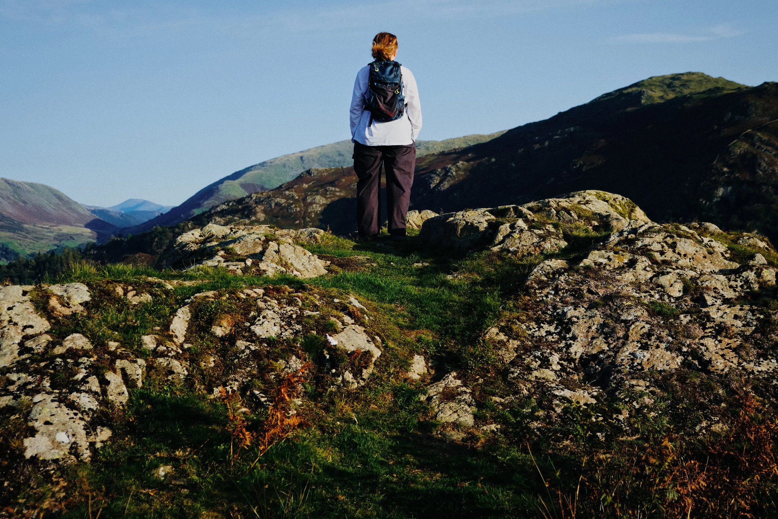 Lisabet pauses to enjoy the views as we navigate our way down the slopes of Loughrigg.