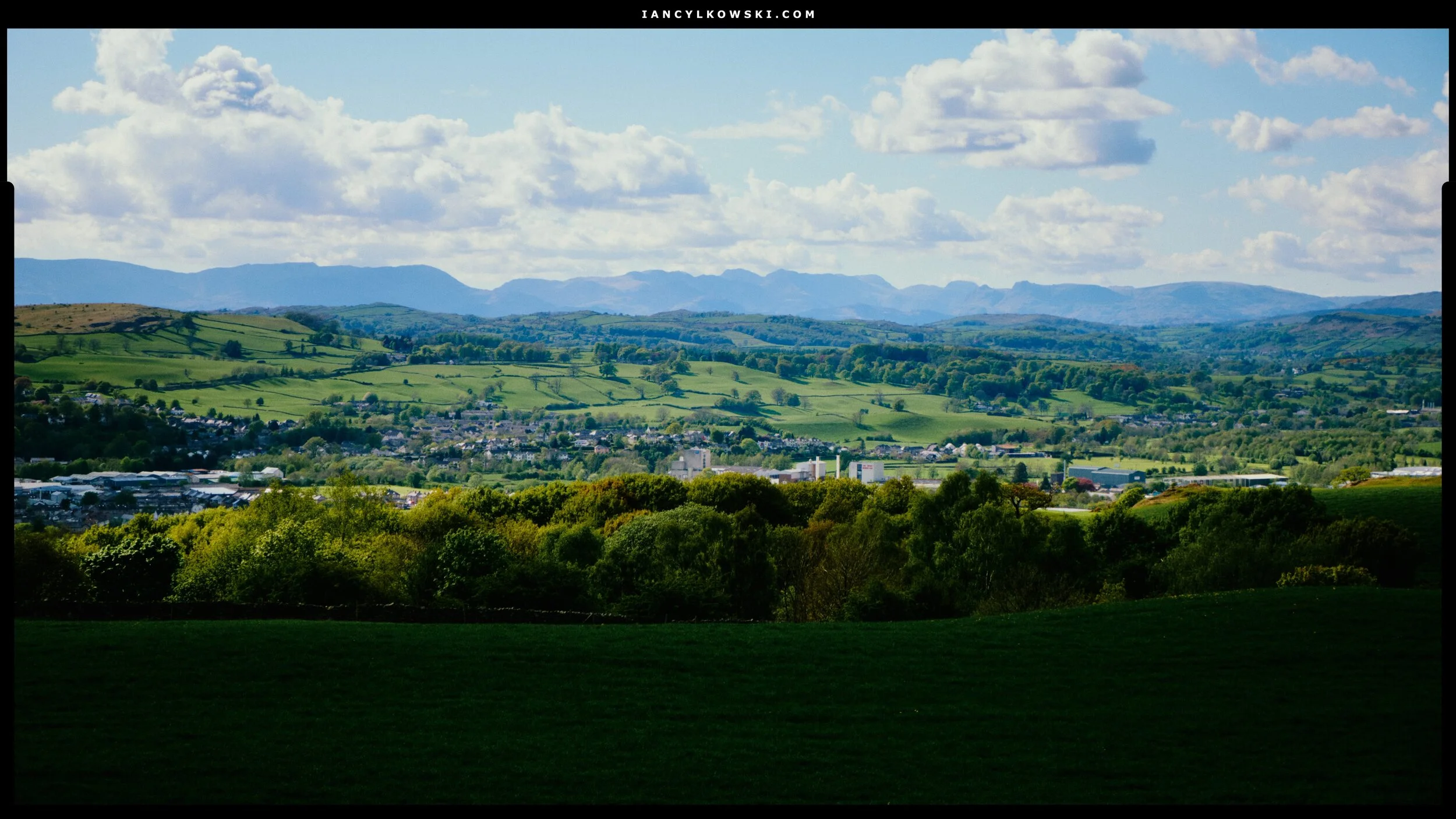 These are the sort of expansive views you get from Paddy’s Lane: Kendal nesting in its valley and the craggy profile of the Lake District fells beyond.