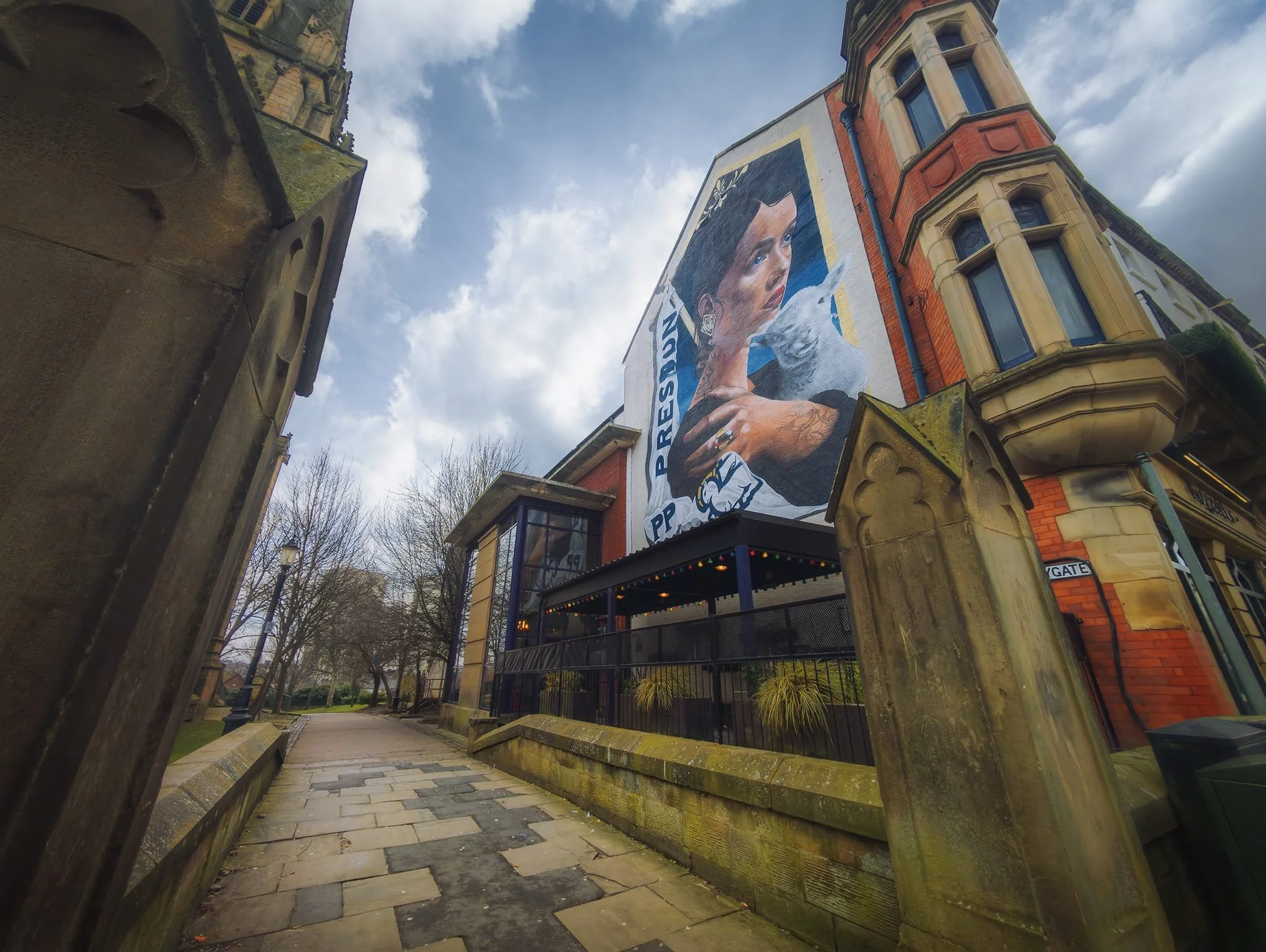 Our first mural of the day: The Mother , by Shawn Sharpe aka REASM . The symbolism of the lamb is often associated with Preston, which can be found on the city’s coat of arms, for example.
