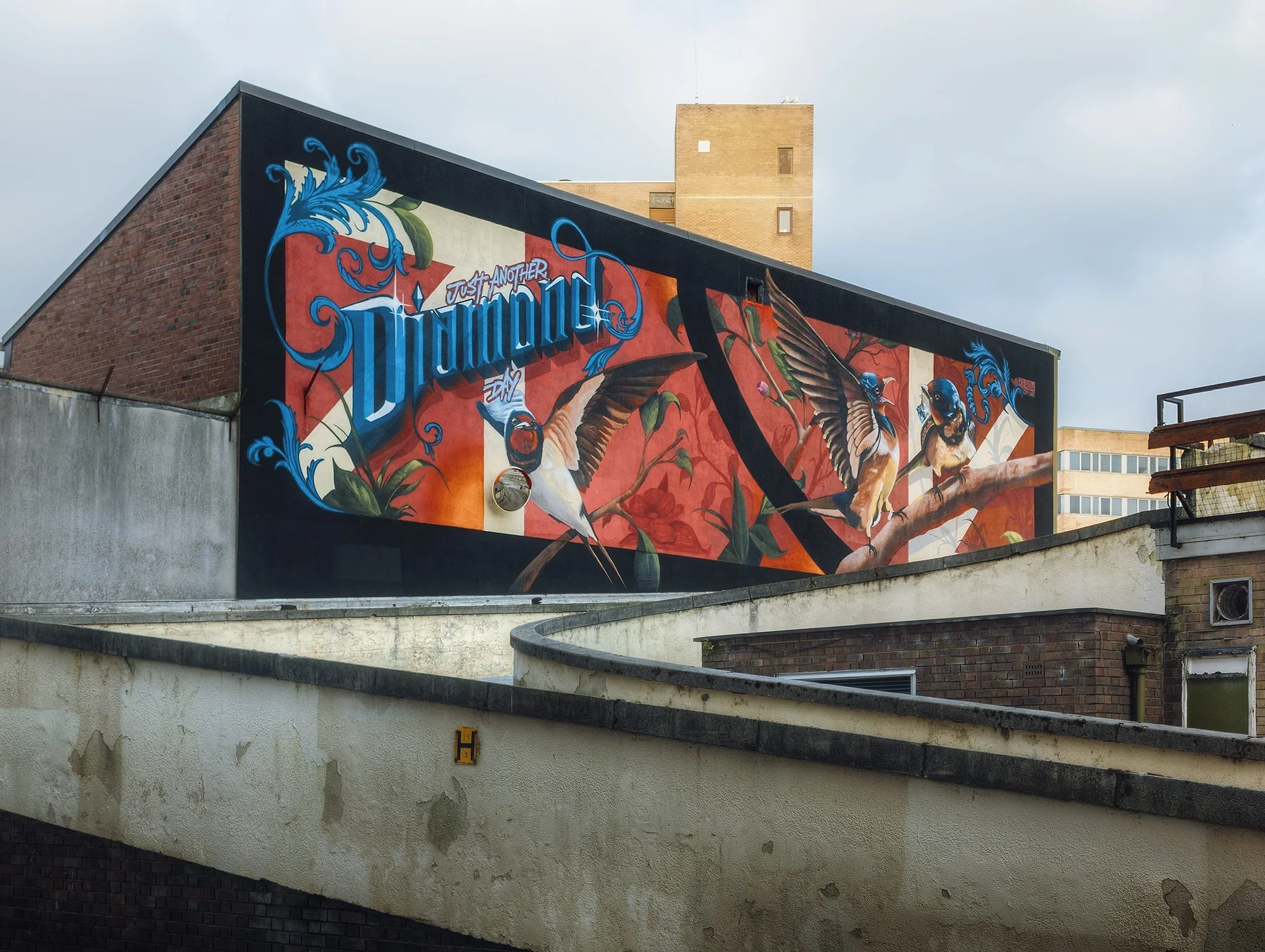 Although not mentioned in the guide we were referencing, we did spot another Shawn Sharpe piece near the bus station, inspired by the lyrics to the song “Diamond Days” by Vashti Bunyan.