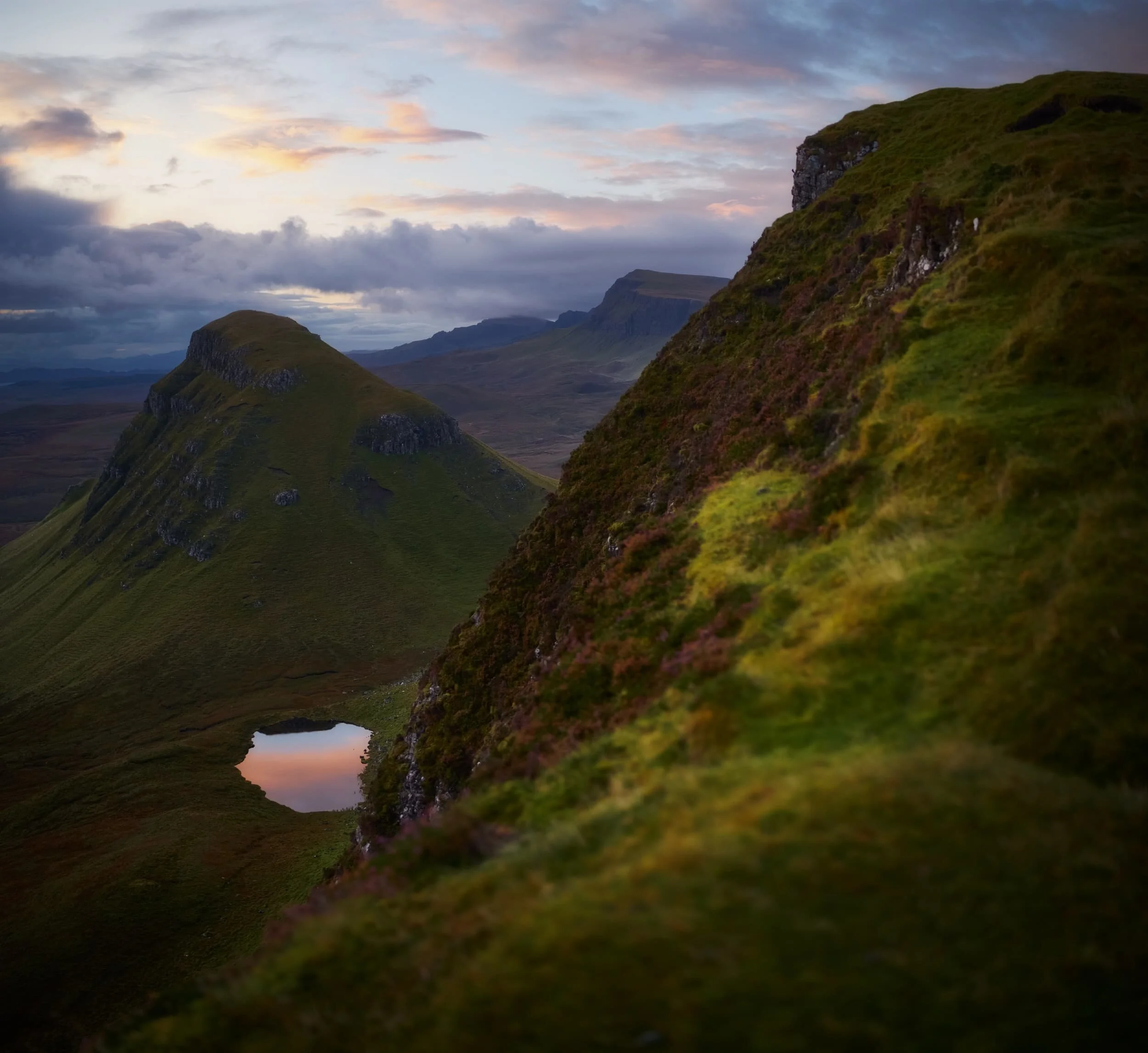 As dawn breaks the sunrise light show gets better and better. This image is made of 6 landscape photos shot on a 35mm/f1.2 lens, stacked top to bottom and merged into a “bokehrama”. The hill on the left is called Cleat (336 m/1,102 ft).
