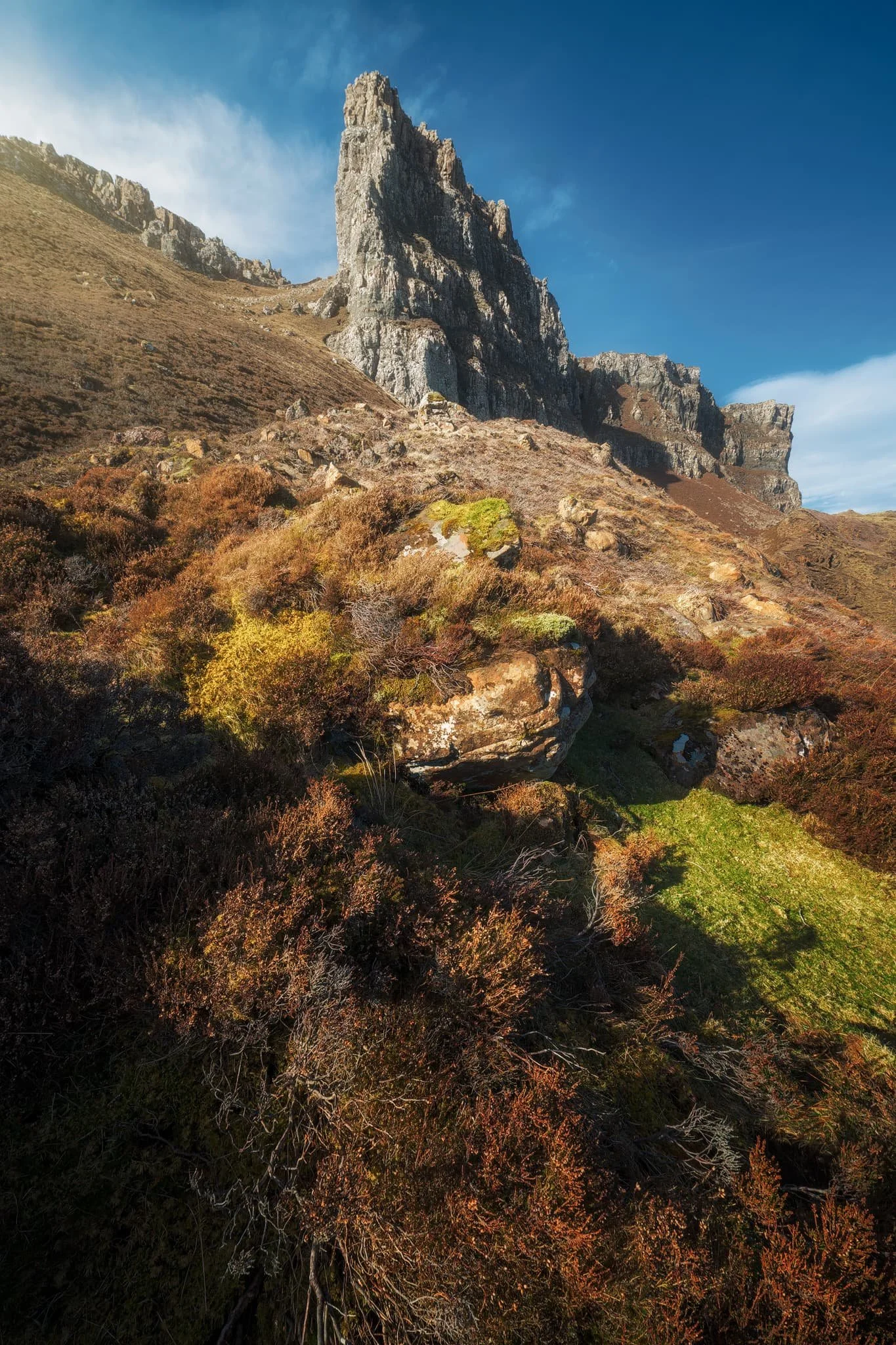 We returned to the trail as it began its steep pull towards the cliffs of Meall na Suiramach , the highest peak of the Quiraing. From the side, the Pinnacles reveal a more slender profile that I couldn’t ignore.
