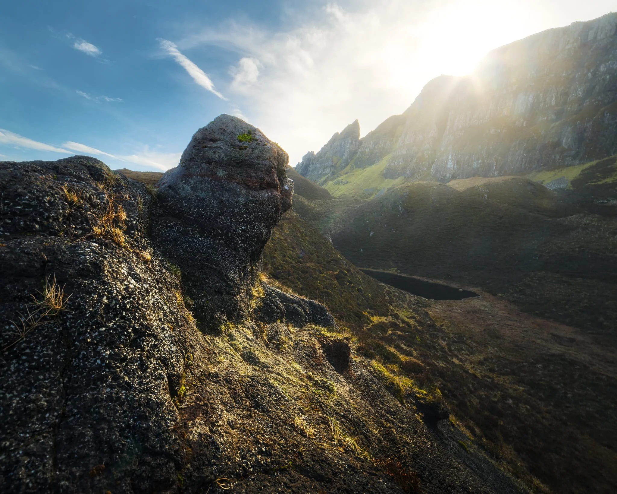 Above Loch Hasco and beneath the cliffs of Meall na Suiramach , we took some rest and explored more fascinating rock formations. I found this weird nubbin of rock as the sun crested above the cliffs of the Quiraing.