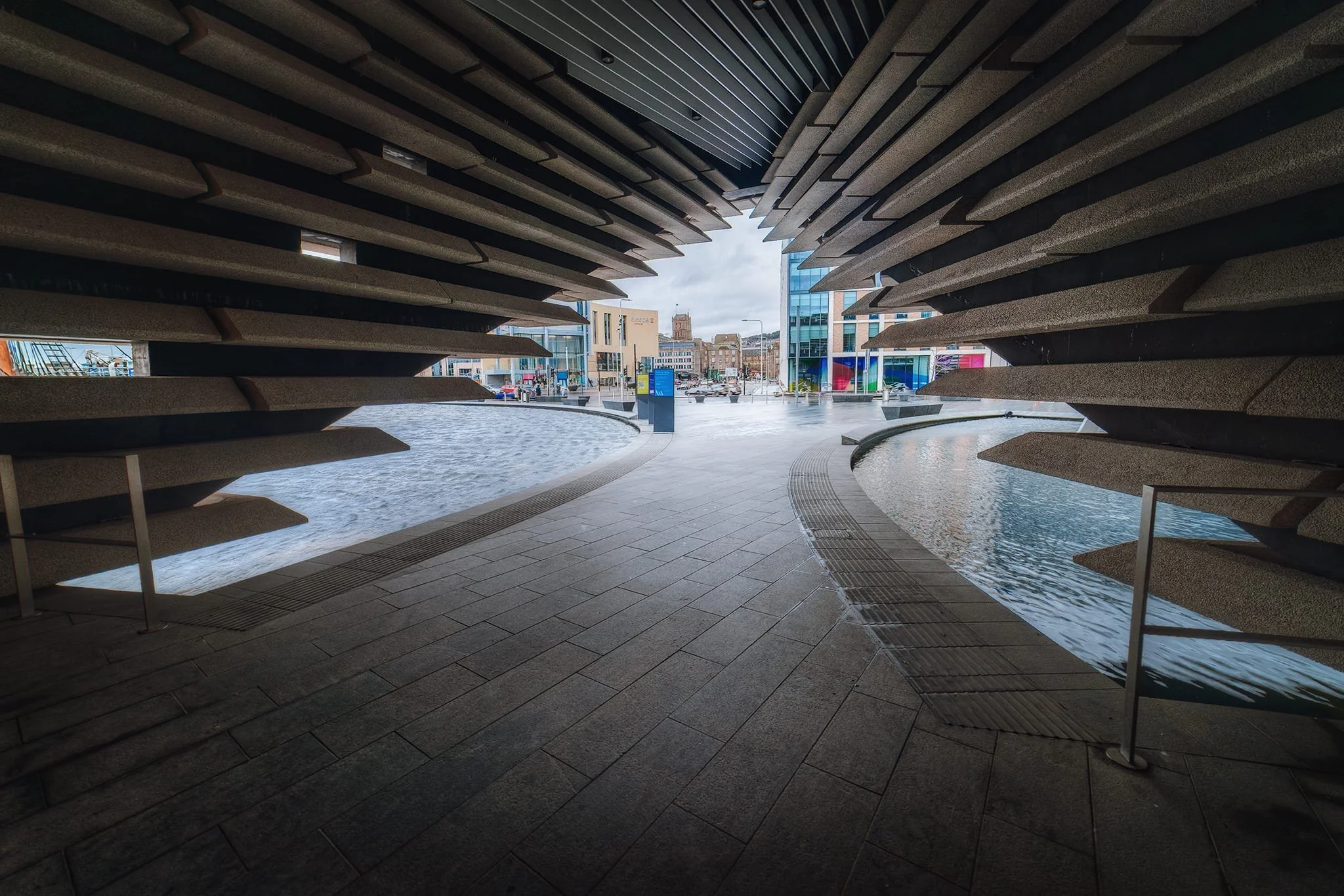 Taking shelter from the rain and using the building’s design as a frame looking back to the city.