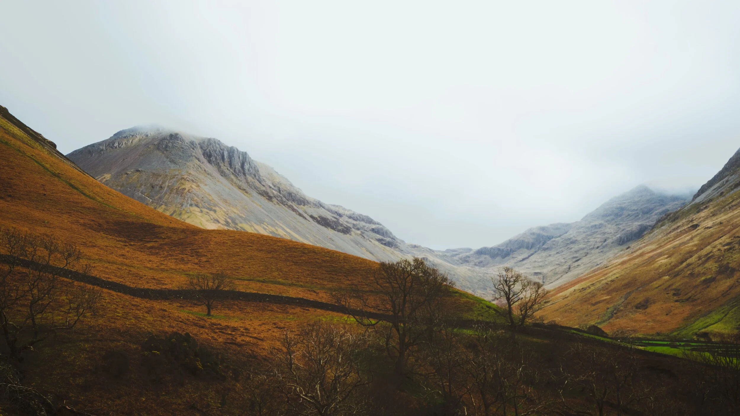 Great Gable (left) and Great End (right, 910 m/2,990 ft) catching some of the brief light shows above Wasdale.