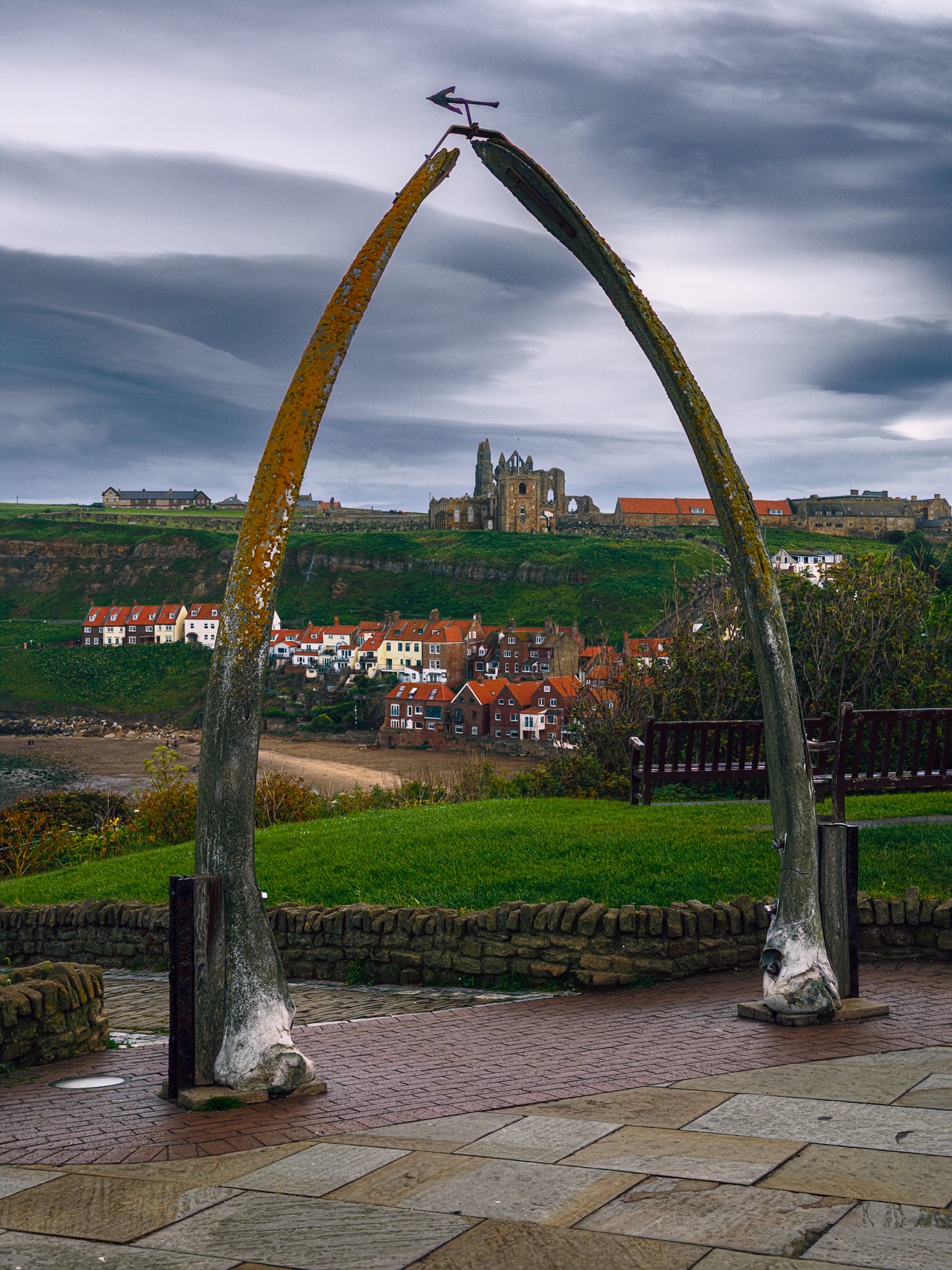 One of Whitby’s most iconic features as you approach from the West Cliffs. An archway made from whale bones, to celebrate the town’s whaling past, is used to frame the distant St Mary’s Church and the ruins of Whitby Abbey behind it.