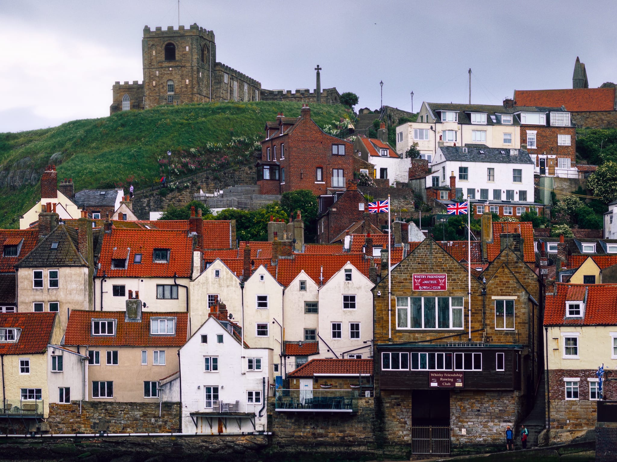A tighter shot of the seemingly chaotic arrangement of houses, pubs, restaurants, and shops that make up the lower slopes of Whitby’s east cliffs. A bit of a mess, but beautiful nonetheless.