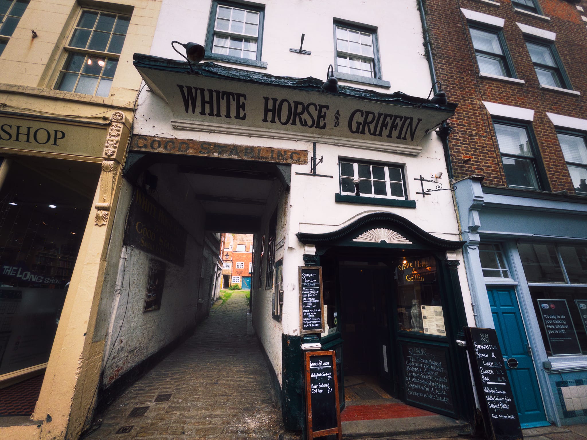 Whitby is full of historical gems (ah-ha!) like this. This is the White Horse & Griffin. Built in 1681 by Sir Hugh Cholmley, this property served as the very first coaching inn running between Whitby, York, and London. Renowned maritime explorers Captain James Cook and William Scoresby used the tavern as a hub to interview, hire, and assemble their ship crews. Charles Dickens visited the establishment and wrote about its unique layout, specifically mentioning the “oyster-shell grottoes” located in the back yard.